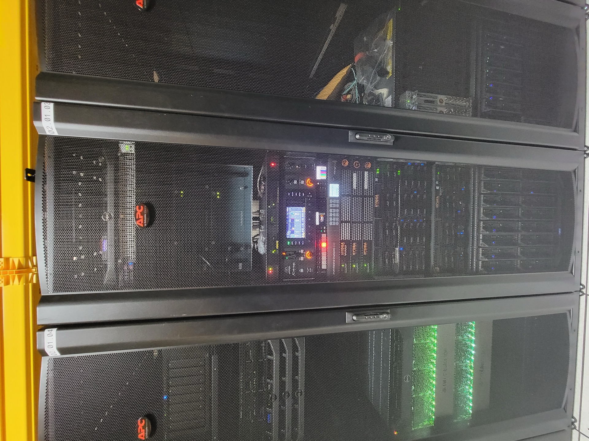 Three full custom racks side by side in the data center, the broadcast and stream gear chain we built.