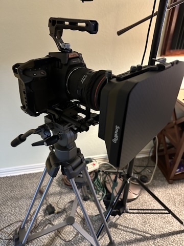 Blackmagic camera with Canon L-series glass on SmallRig cage, monitor attached