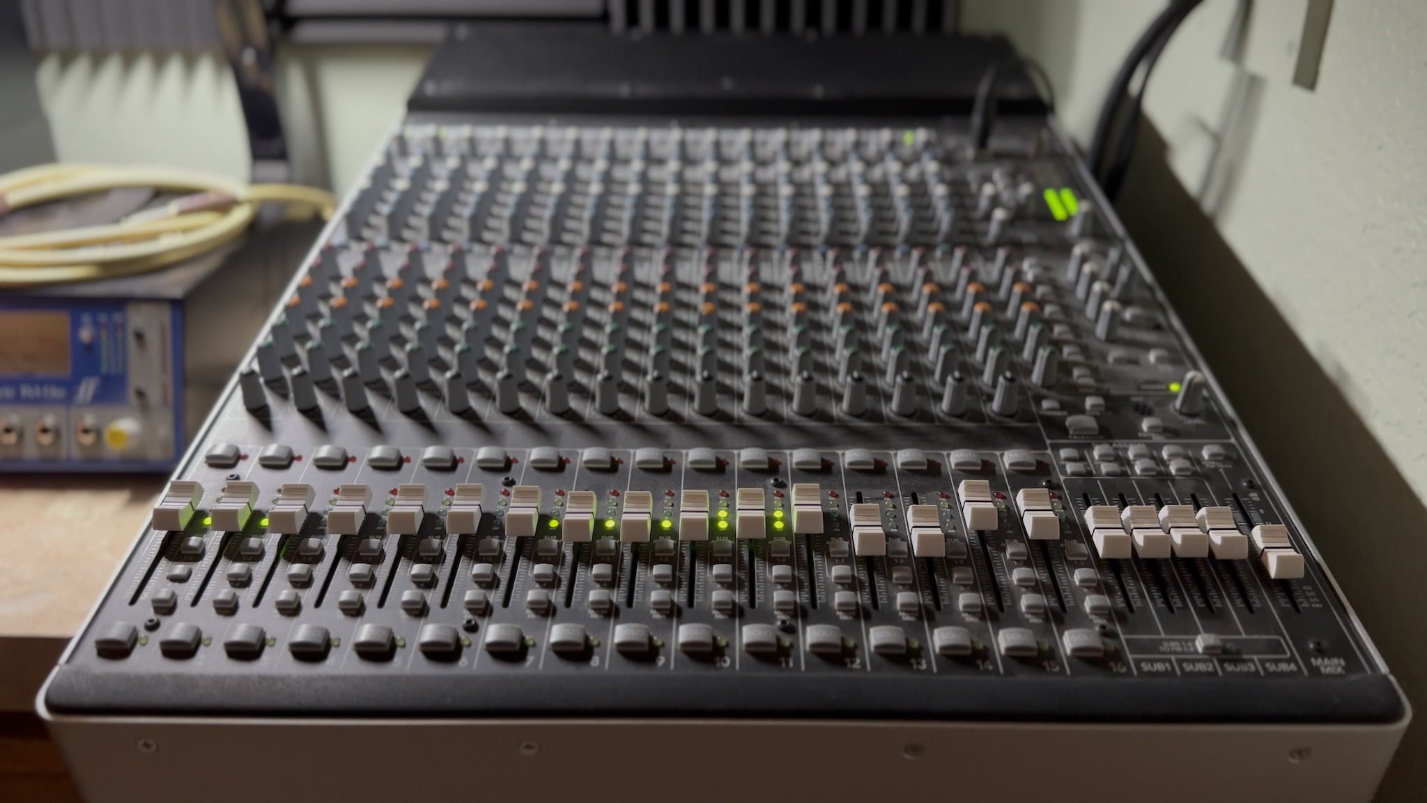 Mackie mixing console with green signal LEDs, all channels hot